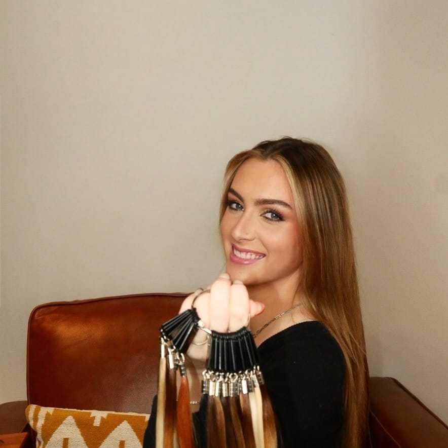Portrait of GG Brown, a professional stylist at O Salon, showcasing their expertise and style.
