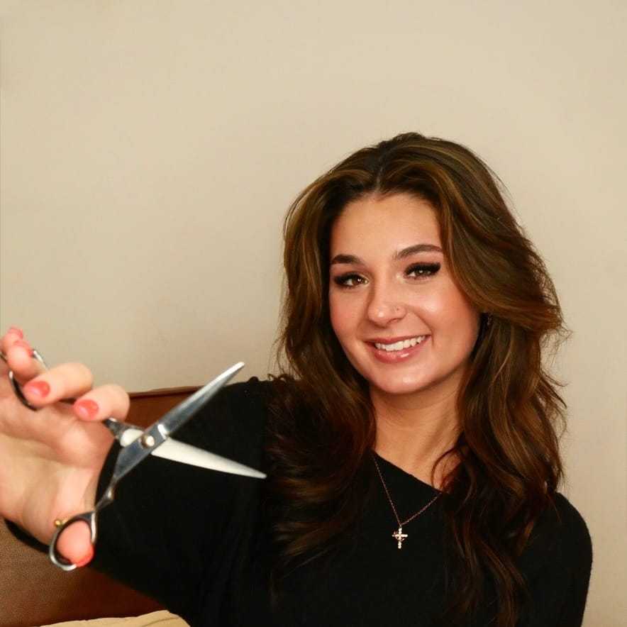 Portrait of Lexi Mulava, a professional stylist at O Salon, showcasing their expertise and style.