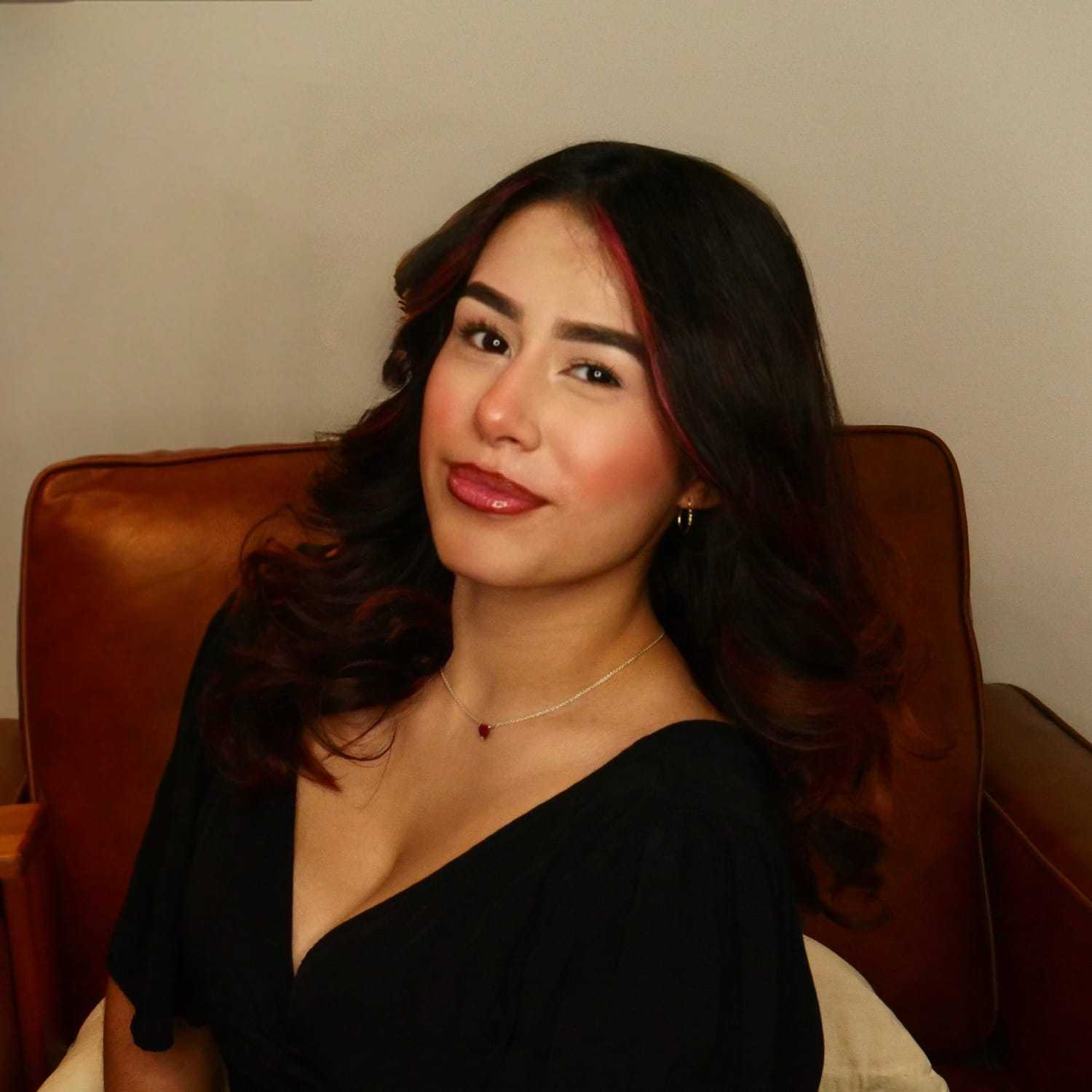 Portrait of Kimmy Garcia, a professional stylist at O Salon, showcasing their expertise and style.