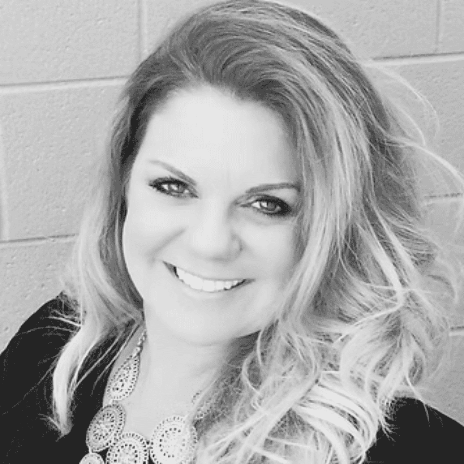 Portrait of Annmarie O'Machel, a professional stylist at O Salon, showcasing their expertise and style.